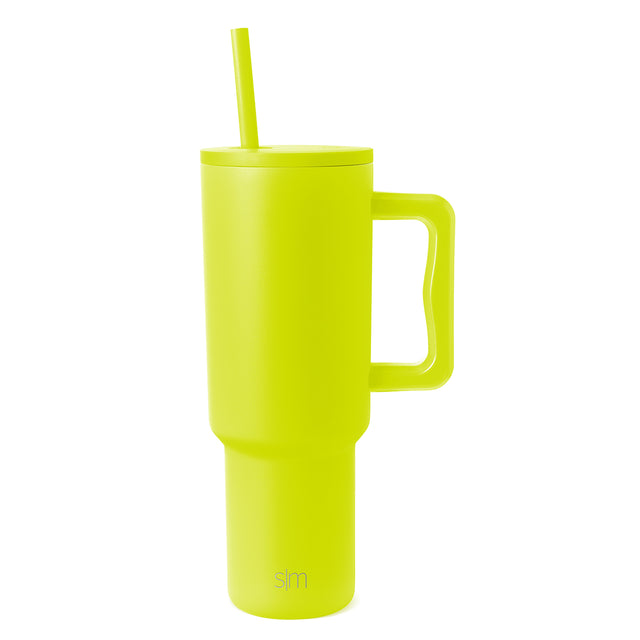 Neon yellow-green insulated tumbler with matching straw and handle on white background Neon yellow-green insulated tumbler with matching straw and handle on white background