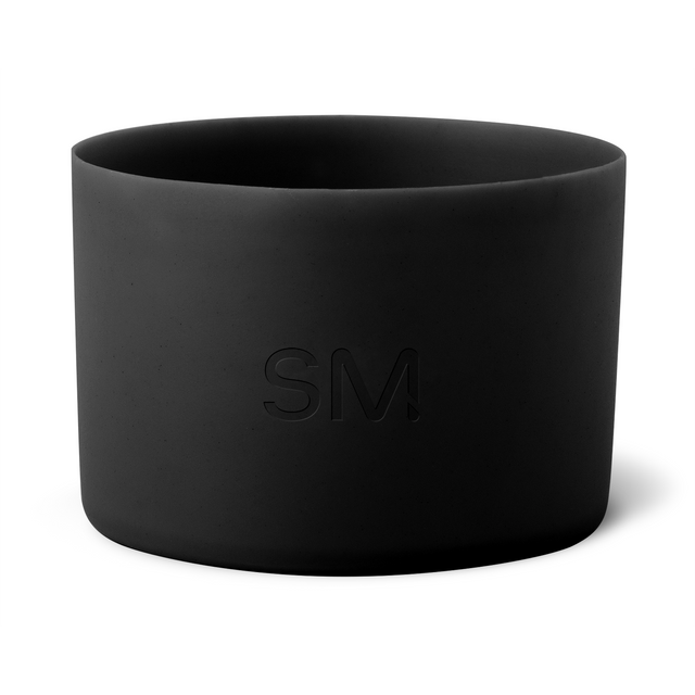 Matte black cylindrical vessel with dark interior walls and neutral background Matte black cylindrical vessel with dark interior walls and neutral background