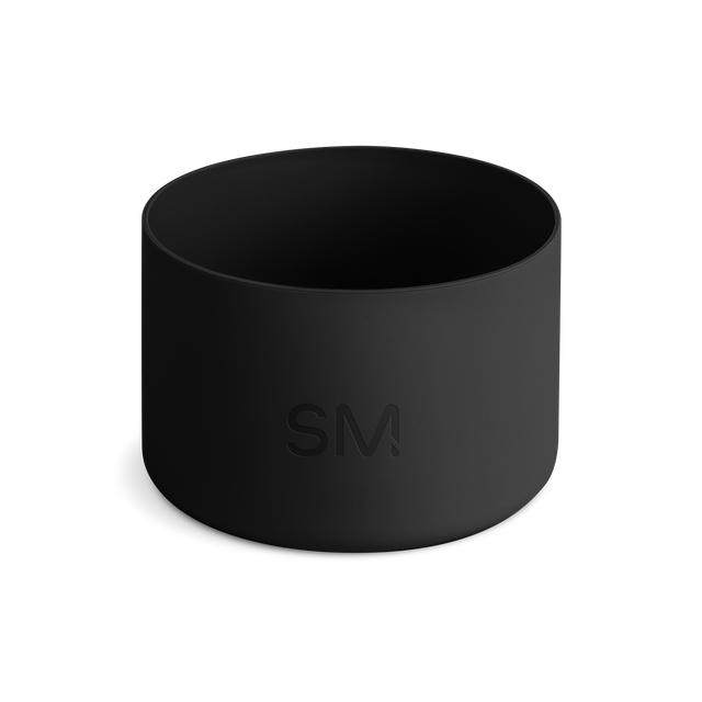 Black cylindrical boot tray on white background, shown from above with open top view revealing interior depth Black cylindrical boot tray on white background, shown from above with open top view revealing interior depth