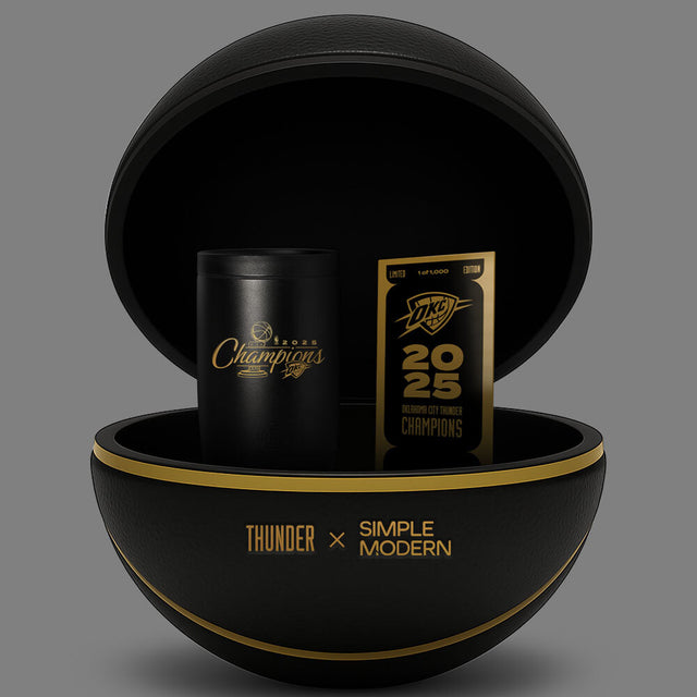 Black and gold spherical container with metallic gold trim accents and deep black interior surfaces Black and gold spherical container with metallic gold trim accents and deep black interior surfaces