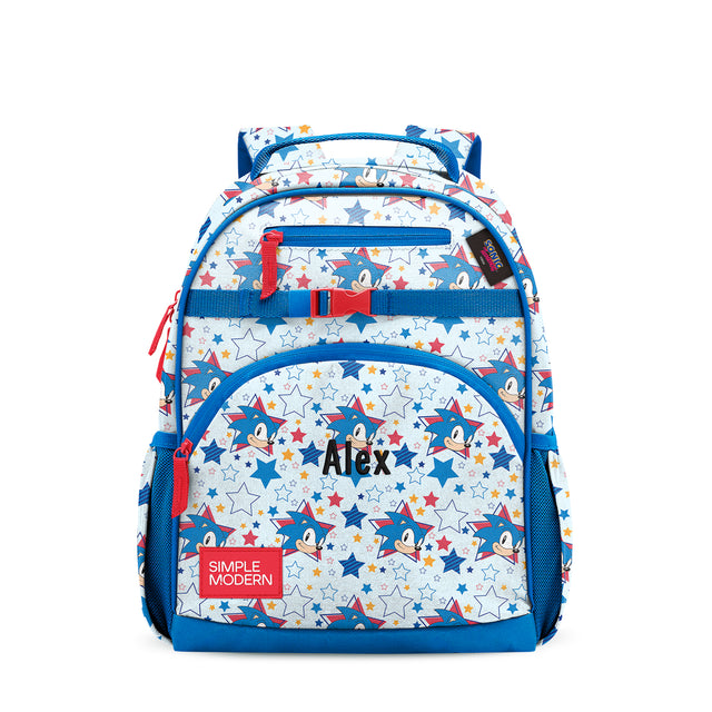 White and blue children's backpack with Sonic character graphics and stars. Features dual padded shoulder straps, multiple zippered compartments, red mesh side pockets, and White and blue children's backpack with Sonic character graphics and stars. Features dual padded shoulder straps, multiple zippered compartments, red mesh side pockets, and