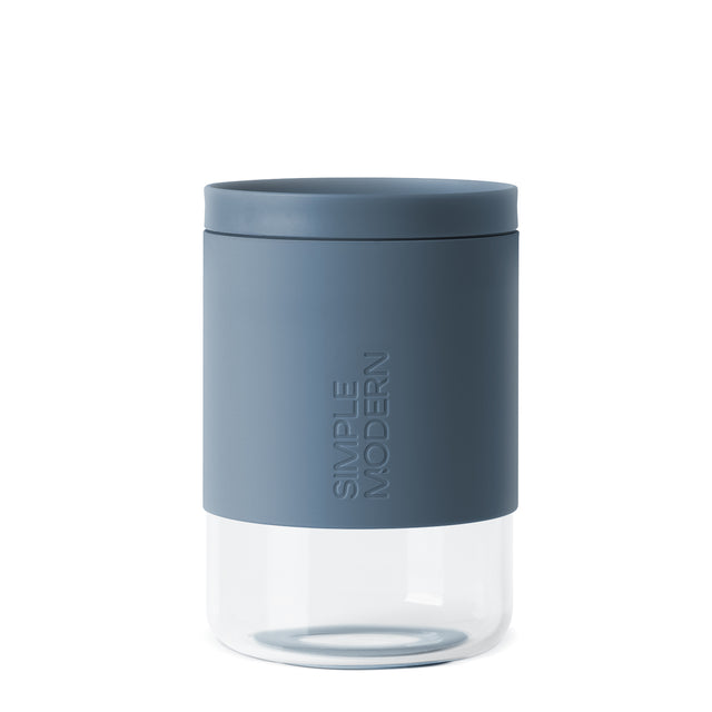 Slate blue cylindrical container with clear white translucent lower section Slate blue cylindrical container with clear white translucent lower section