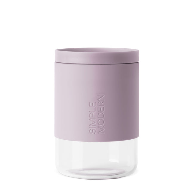 Two-tone container with dusty mauve lid and lower section transitioning to clear material Two-tone container with dusty mauve lid and lower section transitioning to clear material