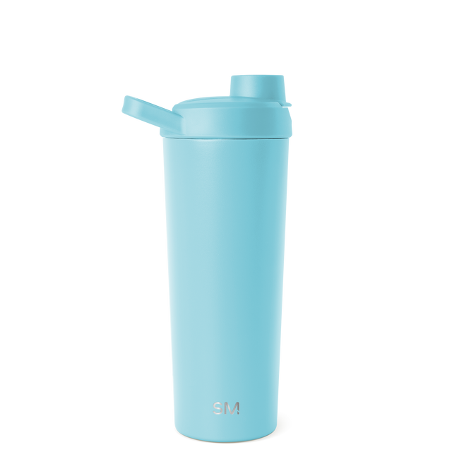 Pale blue-green cylindrical bottle with a pump dispenser and white cap against a clean background. Pale blue-green cylindrical bottle with a pump dispenser and white cap against a clean background.