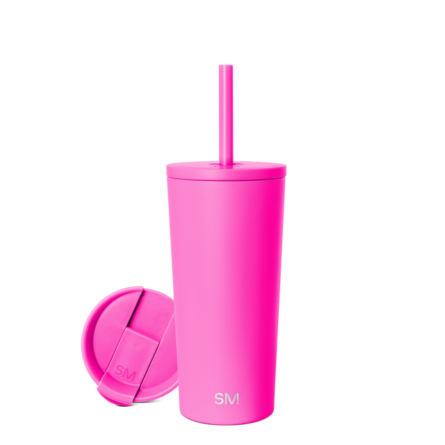 Hot pink tumbler with matching lid, product view against pink background Hot pink tumbler with matching lid, product view against pink background