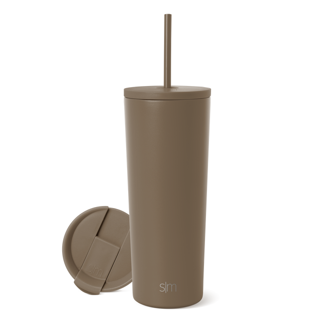 Taupe tumbler with matching lid on neutral background Taupe tumbler with matching lid on neutral background