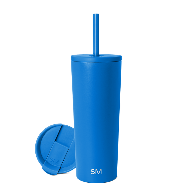 Bright royal blue insulated tumbler with matching lid on white background Bright royal blue insulated tumbler with matching lid on white background