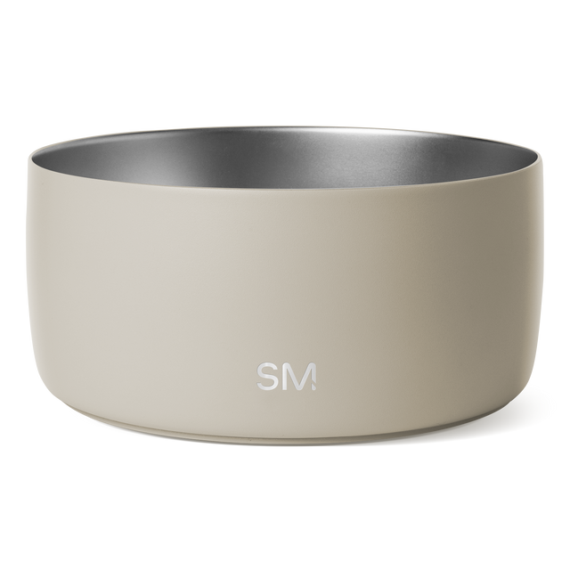 Beige ceramic vessel with brushed stainless steel silver-gray interior rim, isolated on white background Beige ceramic vessel with brushed stainless steel silver-gray interior rim, isolated on white background