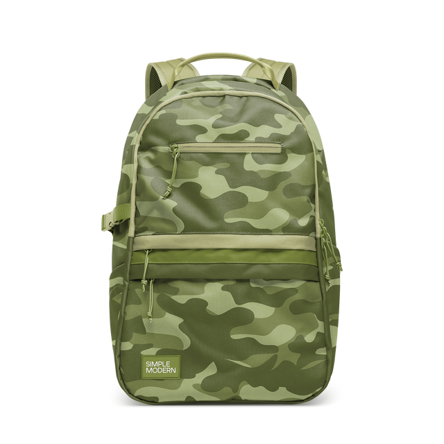 Sage green and cream camouflage patterned backpack with dark olive, medium sage, light cream, and pale yellow-green tones throughout the design. Sage green and cream camouflage patterned backpack with dark olive, medium sage, light cream, and pale yellow-green tones throughout the design.