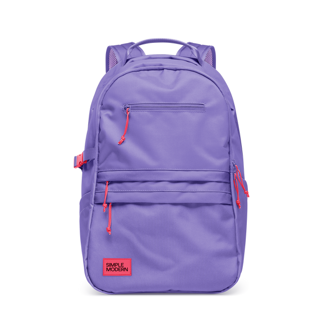 Periwinkle purple backpack with coral red zipper pulls and mesh panel details Periwinkle purple backpack with coral red zipper pulls and mesh panel details