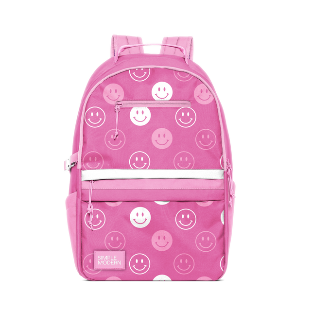 Hot pink backpack with white and light pink smiley face designs throughout Hot pink backpack with white and light pink smiley face designs throughout