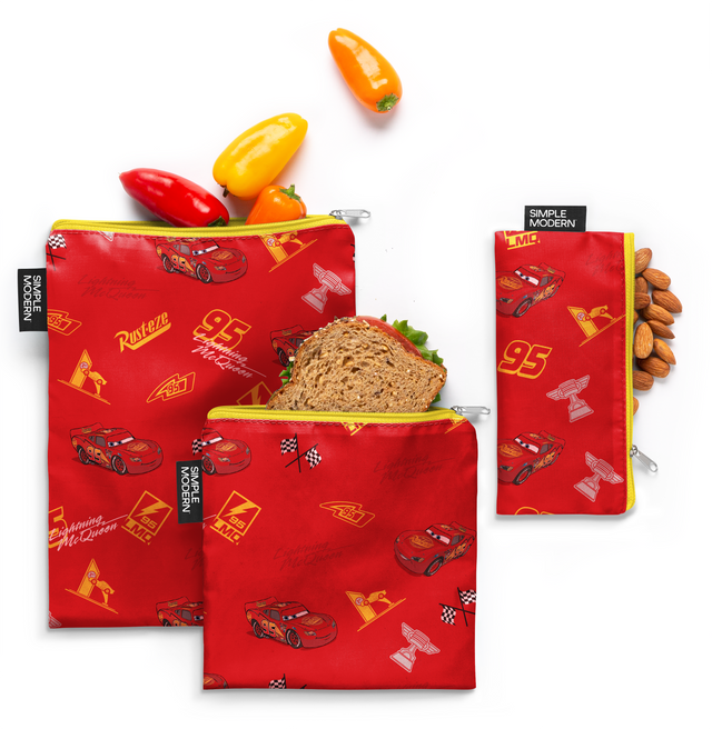 Red fabric with yellow zippers and yellow accents, featuring peppers and almonds pattern Red fabric with yellow zippers and yellow accents, featuring peppers and almonds pattern
