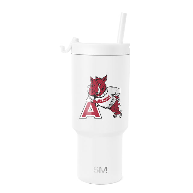 White tumbler with red and dark red mascot and logo graphics, white lid and straw, SM logo imprint visible. White tumbler with red and dark red mascot and logo graphics, white lid and straw, SM logo imprint visible.