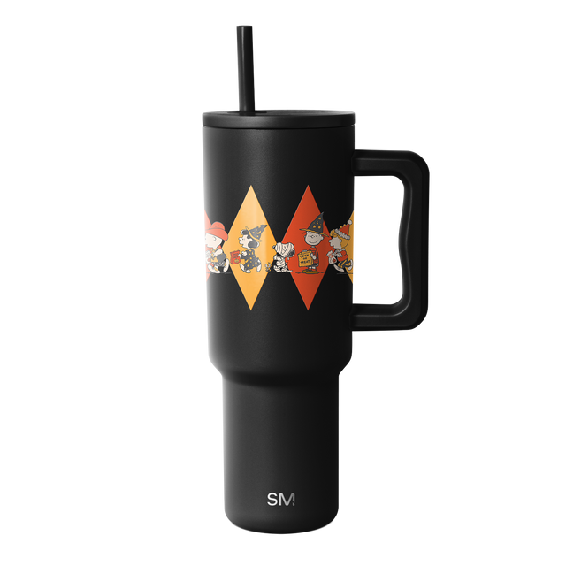 Matte black insulated tumbler with bright orange-red and golden yellow geometric diamond shapes in the center of the design. Matte black insulated tumbler with bright orange-red and golden yellow geometric diamond shapes in the center of the design.