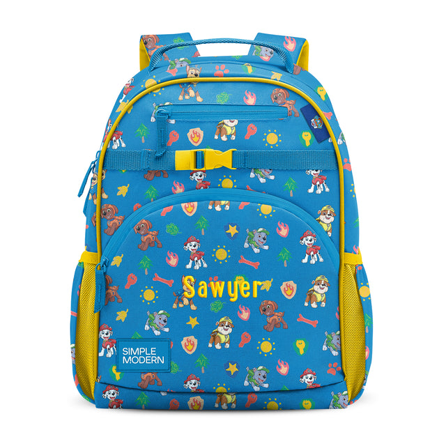 Bright blue children's backpack with yellow accents, yellow chest strap, and dual padded shoulder straps. Features Paw Patrol character graphics, colorful pattern with bones, stars, and trees. Bright blue children's backpack with yellow accents, yellow chest strap, and dual padded shoulder straps. Features Paw Patrol character graphics, colorful pattern with bones, stars, and trees.