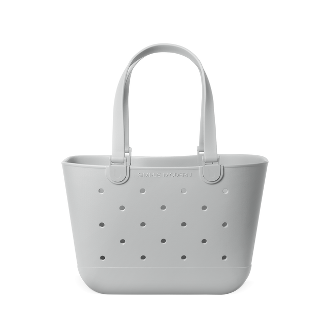 Light gray perforated tote bag with handles, displayed against white background Light gray perforated tote bag with handles, displayed against white background