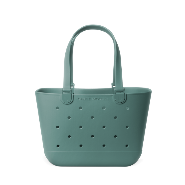 Soft sage green tote bag with matching handles and structural elements Soft sage green tote bag with matching handles and structural elements