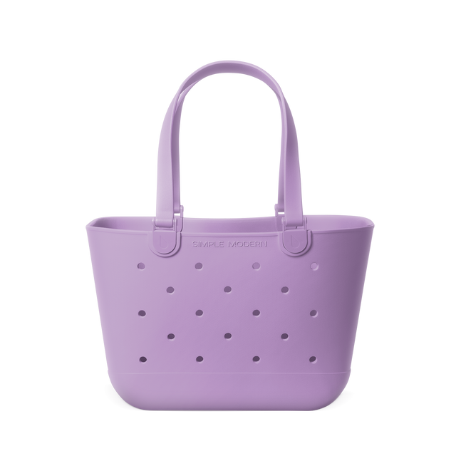 Soft lavender tote bag with simple modern design, featuring a muted lilac purple color throughout the entire canvas bag structure. Soft lavender tote bag with simple modern design, featuring a muted lilac purple color throughout the entire canvas bag structure.