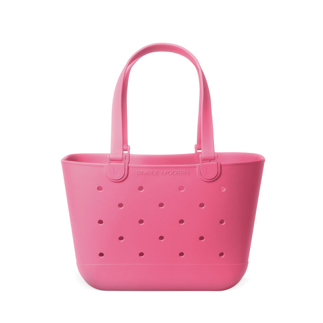 Bubblegum pink molded plastic tote bag with lighter and deeper pink tones on white background Bubblegum pink molded plastic tote bag with lighter and deeper pink tones on white background