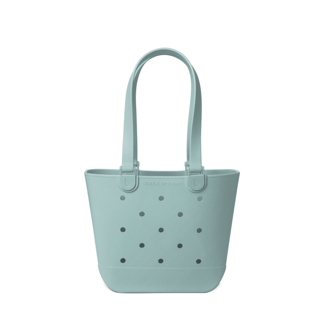 Soft sage green tote bag with matching handles and subtle dark gray accents Soft sage green tote bag with matching handles and subtle dark gray accents