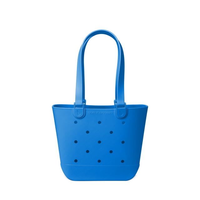 Royal blue tote bag with navy polka dots on off-white background Royal blue tote bag with navy polka dots on off-white background