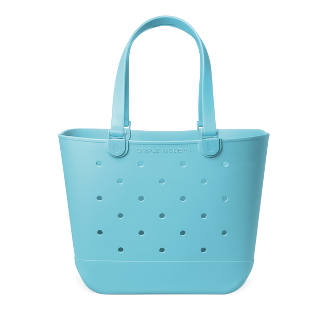 Soft turquoise teal tote bag with handles displayed against a white background. Large capacity bag suitable for everyday use and shopping. Soft turquoise teal tote bag with handles displayed against a white background. Large capacity bag suitable for everyday use and shopping.