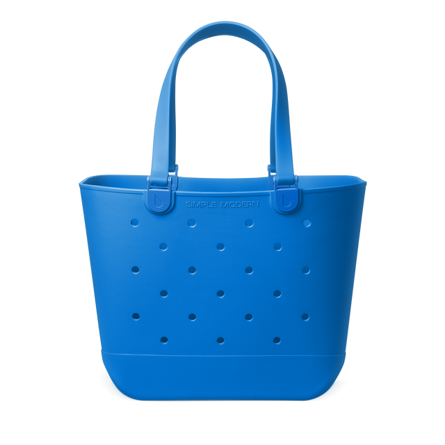 Royal blue tote bag with handles on white background Royal blue tote bag with handles on white background
