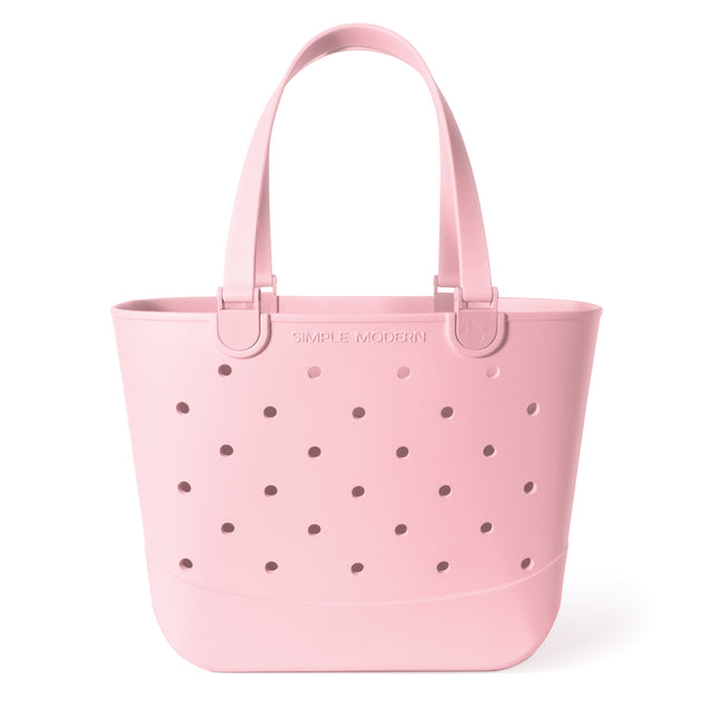 Soft pale pink tote bag with mauve circular perforations throughout the fabric, creating a textured pattern. Large capacity carryall with handles, shown against a neutral background. Soft pale pink tote bag with mauve circular perforations throughout the fabric, creating a textured pattern. Large capacity carryall with handles, shown against a neutral background.