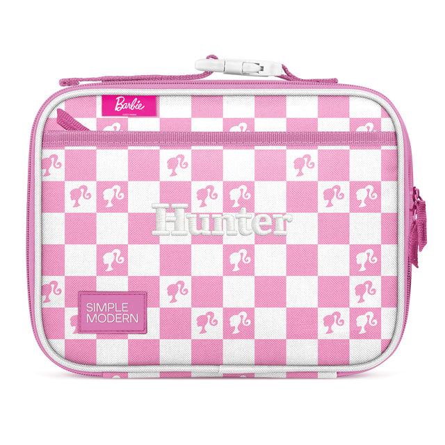 Pink and white checkerboard insulated lunch box with Barbie branding, quilted material, top zip closure, pink carrying handles, and Pink and white checkerboard insulated lunch box with Barbie branding, quilted material, top zip closure, pink carrying handles, and