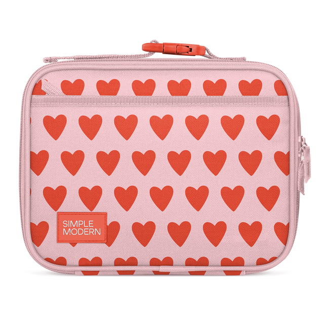 Soft pink fabric with repeating coral-red heart pattern, featuring pink zipper pull and side handles Soft pink fabric with repeating coral-red heart pattern, featuring pink zipper pull and side handles