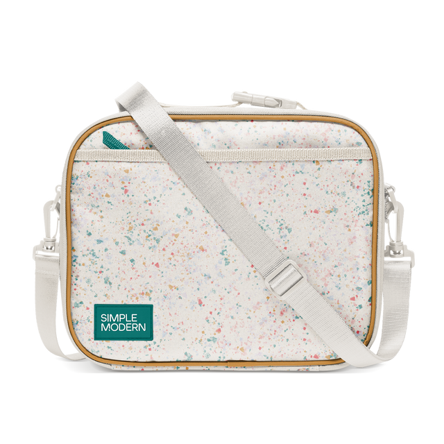 Cream colored canvas tote bag with multicolored speckled pattern in pink, coral, teal, turquoise, yellow-orange, and light blue throughout. Cream colored canvas tote bag with multicolored speckled pattern in pink, coral, teal, turquoise, yellow-orange, and light blue throughout.