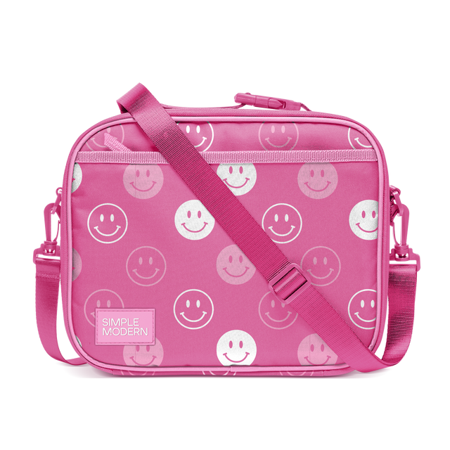 Hot pink smiley face crossbody bag with white and light pink smiling designs, featuring a ribbed textured hot pink shoulder strap. Hot pink smiley face crossbody bag with white and light pink smiling designs, featuring a ribbed textured hot pink shoulder strap.