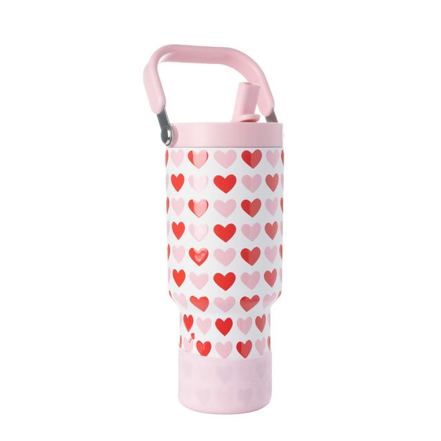 Simple Modern water bottle with white base and repeating heart pattern on central band, displayed against white background Simple Modern water bottle with white base and repeating heart pattern on central band, displayed against white background