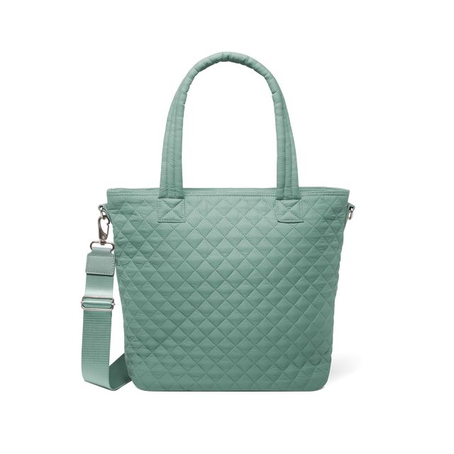 Sage green quilted tote bag with dual handles and detachable shoulder strap, front view Sage green quilted tote bag with dual handles and detachable shoulder strap, front view