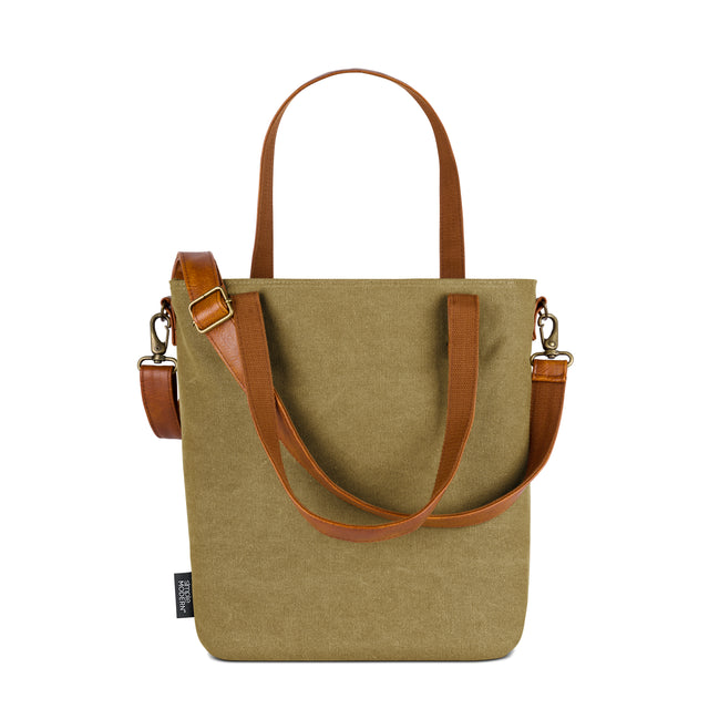 Sage green canvas tote bag with cognac brown leather handles and side accents Sage green canvas tote bag with cognac brown leather handles and side accents