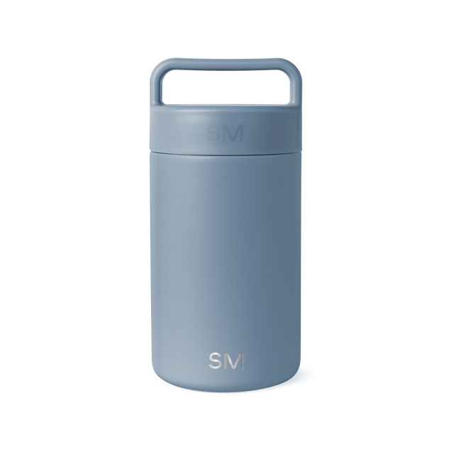 Dusty blue-gray ceramic jar with cylindrical shape and neutral muted tone on white background Dusty blue-gray ceramic jar with cylindrical shape and neutral muted tone on white background