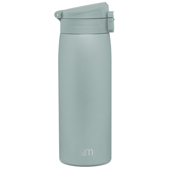 Sage green cylindrical water bottle with matching lid, featuring a soft muted seafoam tone throughout the entire product design. Sage green cylindrical water bottle with matching lid, featuring a soft muted seafoam tone throughout the entire product design.