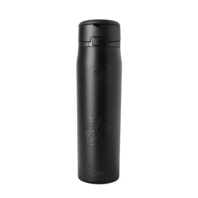 Black cylindrical bottle with matte charcoal finish on white background Black cylindrical bottle with matte charcoal finish on white background