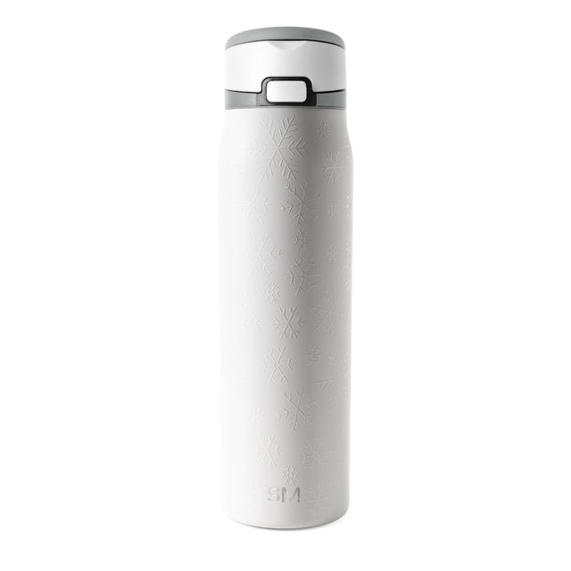 White insulated tumbler with gray lid on plain background White insulated tumbler with gray lid on plain background