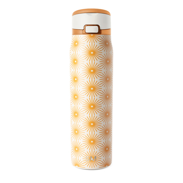 Cream cylindrical bottle with repeating geometric pattern in warm golden orange on neutral background Cream cylindrical bottle with repeating geometric pattern in warm golden orange on neutral background