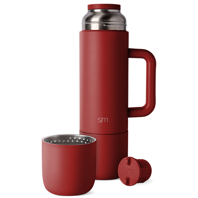 Deep burgundy red product with removable components and brushed stainless steel silver interior lid Deep burgundy red product with removable components and brushed stainless steel silver interior lid