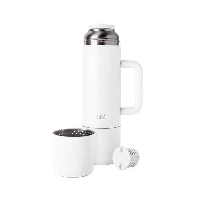 White stainless steel insulated beverage vessel with polished silver lid and internal strainer, front view White stainless steel insulated beverage vessel with polished silver lid and internal strainer, front view