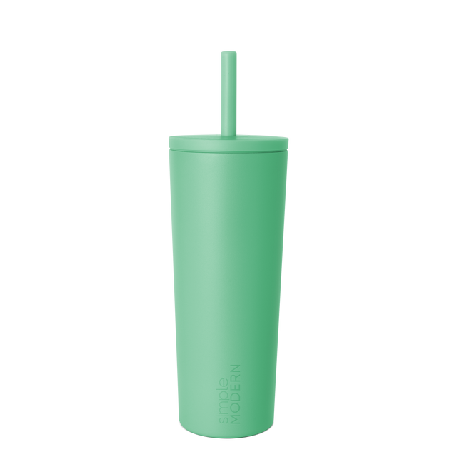 Pale mint green tumbler with lid on white background Pale mint green tumbler with lid on white background