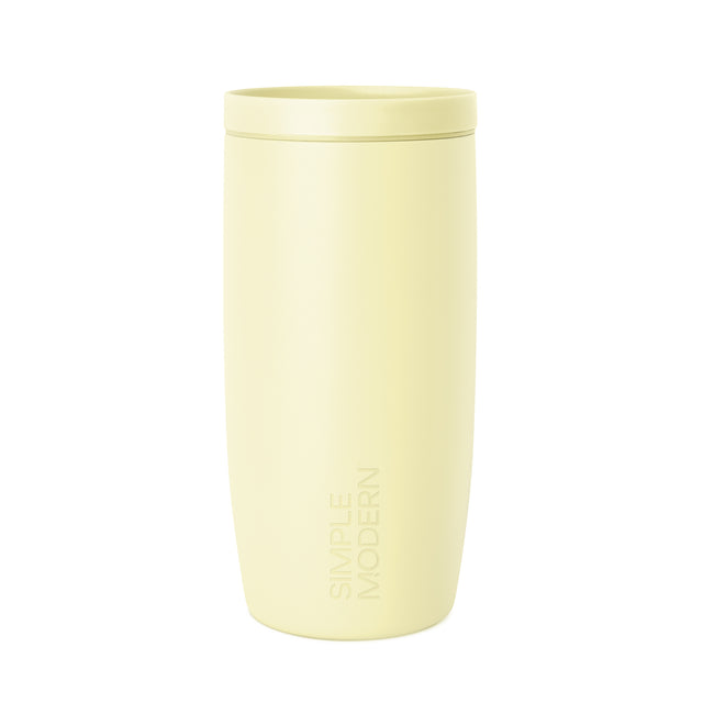 Soft pale yellow-cream colored tumbler with a white background Soft pale yellow-cream colored tumbler with a white background