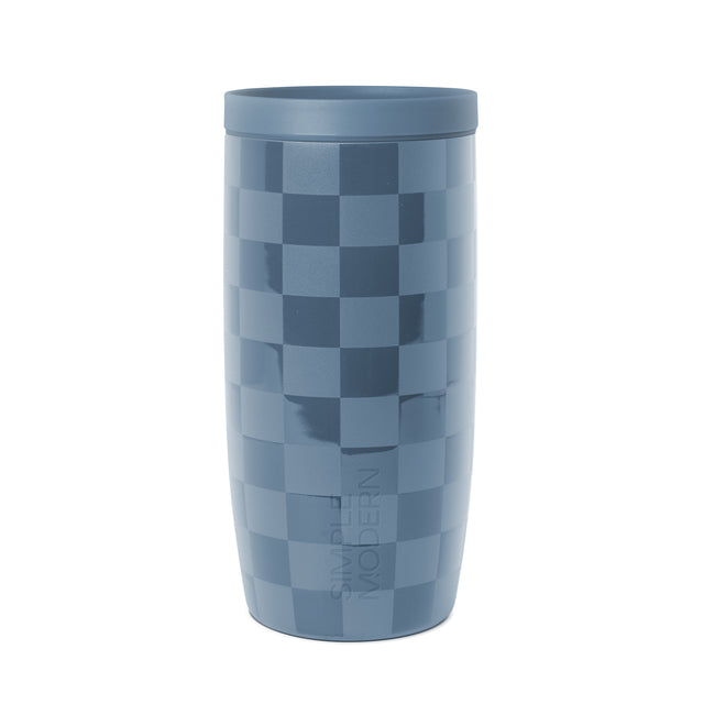 Blue and gray checkerboard patterned drinkware with lid, featuring light slate blue, medium blue-gray, and navy blue tones arranged in geometric squares. Blue and gray checkerboard patterned drinkware with lid, featuring light slate blue, medium blue-gray, and navy blue tones arranged in geometric squares.