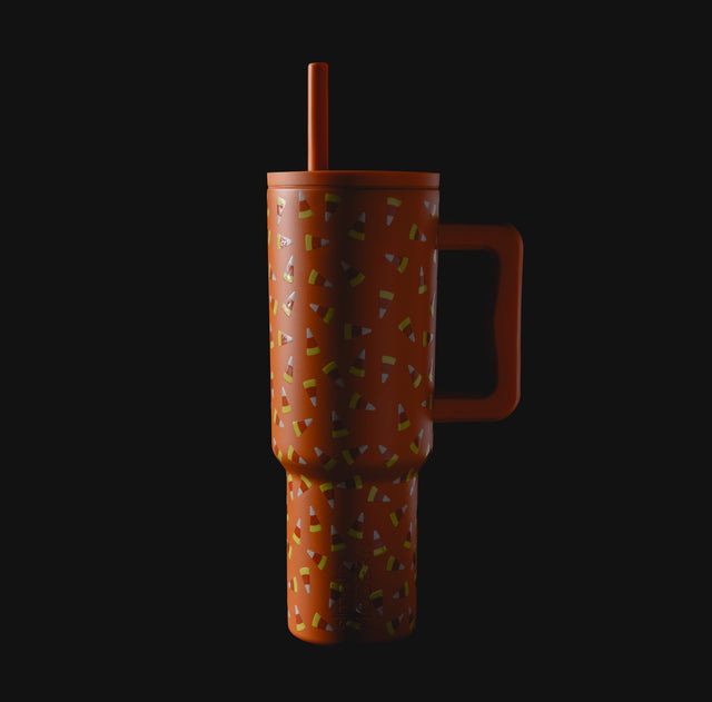 Burnt orange tumbler with yellow, lime green, white, and purple accents Burnt orange tumbler with yellow, lime green, white, and purple accents