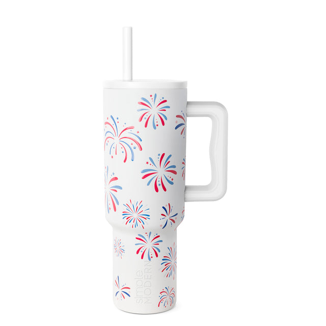 White tumbler with red and blue firework illustrations in a patriotic design pattern White tumbler with red and blue firework illustrations in a patriotic design pattern