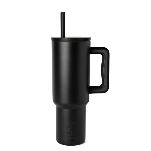 Matte black tumbler with gray tonal variations on white background Matte black tumbler with gray tonal variations on white background