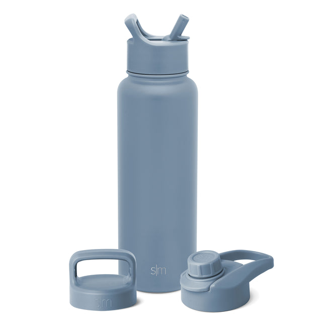 Soft blue-gray water bottle with three interchangeable lids displayed on white background Soft blue-gray water bottle with three interchangeable lids displayed on white background