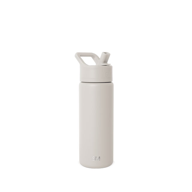 Cream-colored water bottle with matching cap on white background Cream-colored water bottle with matching cap on white background